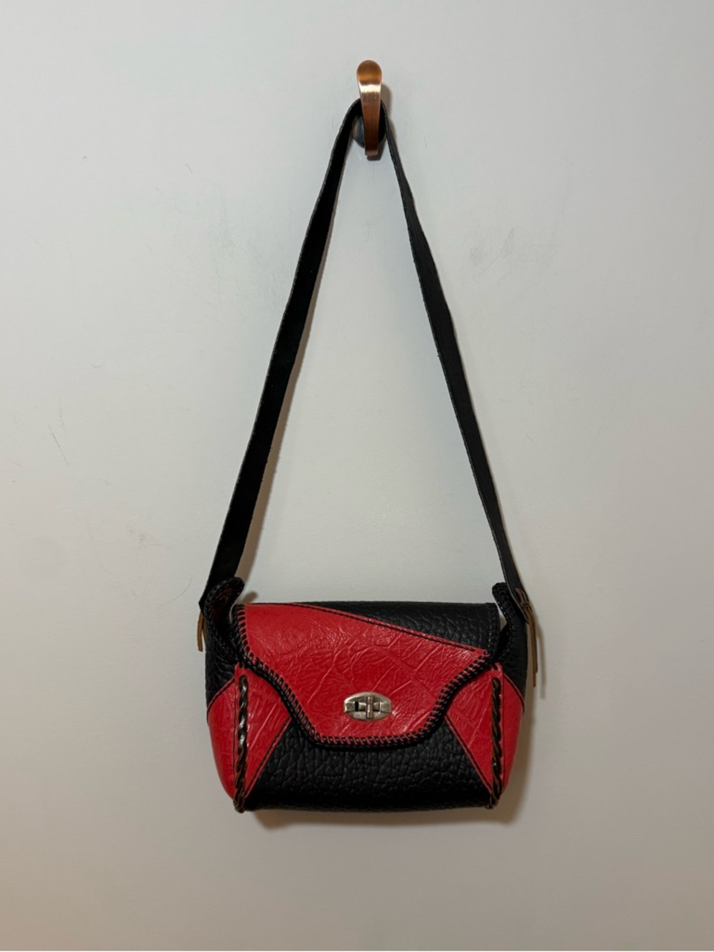 Vintage western leather black and red braided sides fringe shoulder bag purse.